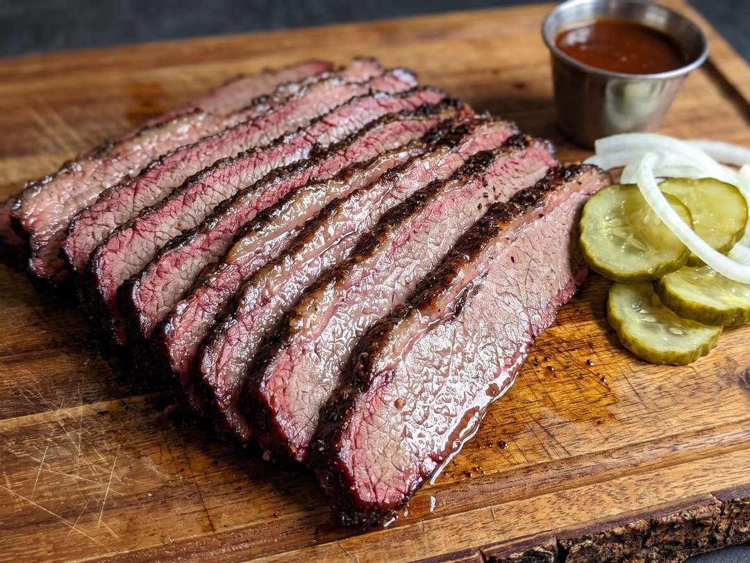 Close-up of a brisket slice showing the smoke ring and rendered fat